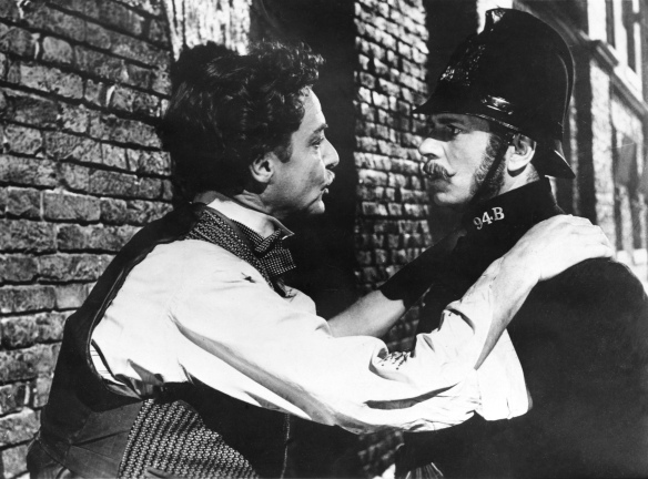 Robert Donat (left) and Laurence Olivier in a cameo as a London bobby in The Magic Box (1951).